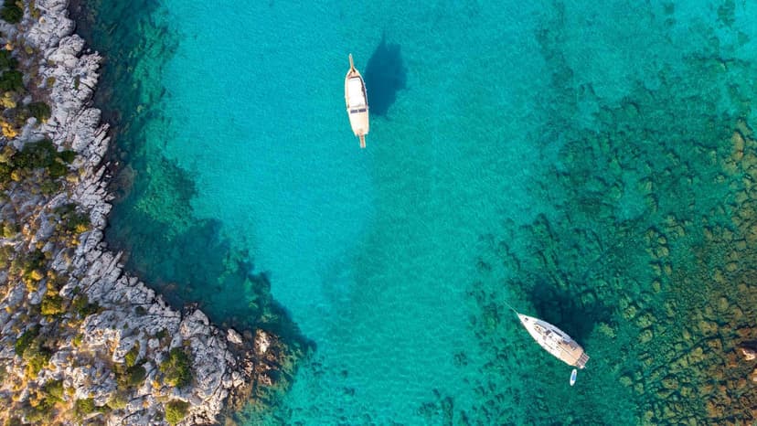 Turquoise waters of Kekova bay with traditional boats along the Mediterranean coast